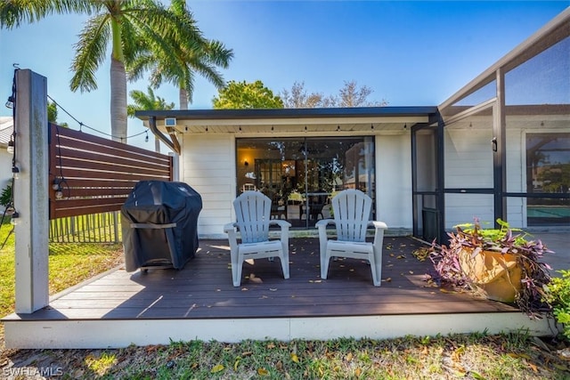 wooden terrace featuring grilling area