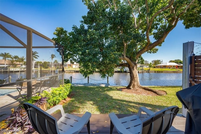 view of patio / terrace featuring a boat dock and a water view