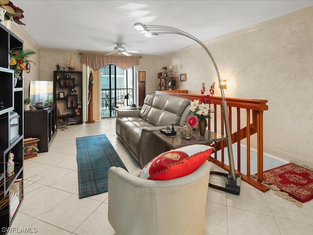 tiled living room featuring ceiling fan and crown molding