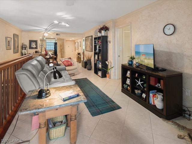 living room featuring crown molding and light tile floors