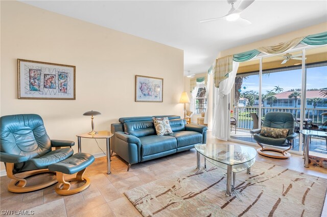 tiled living room featuring ceiling fan