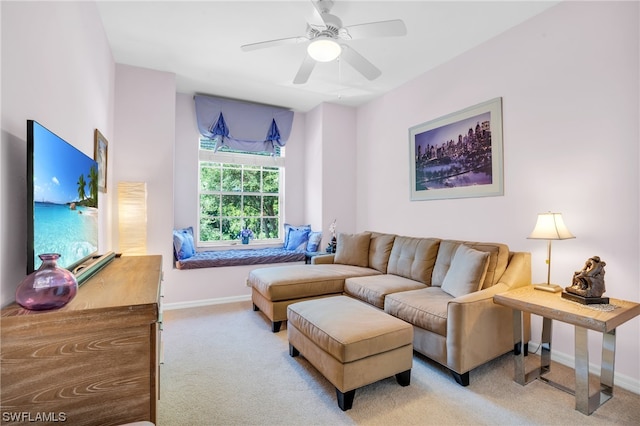 carpeted living room featuring ceiling fan