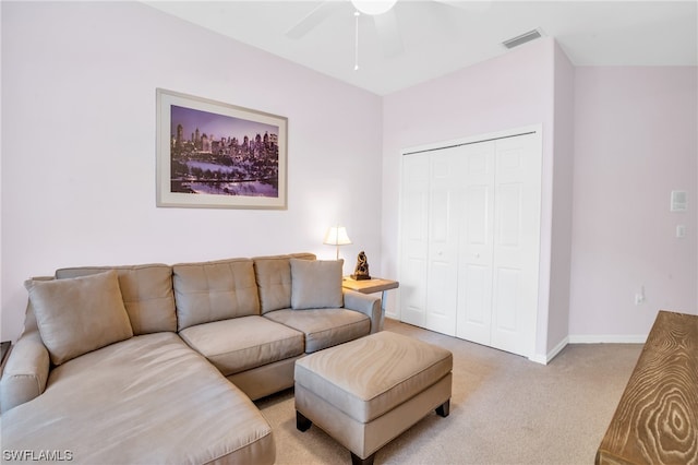 carpeted living room featuring ceiling fan