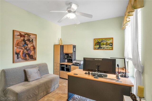 office space featuring light tile patterned floors and ceiling fan