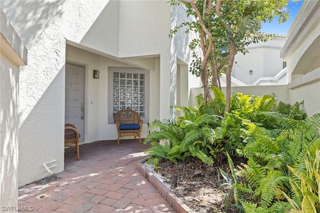 entrance to property with a patio area