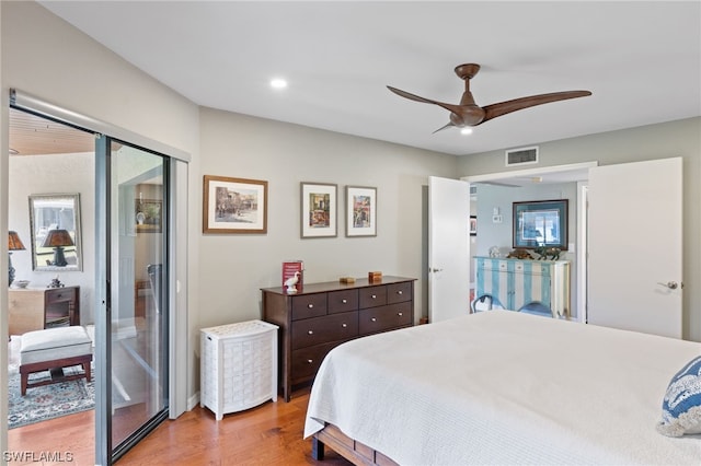 bedroom featuring light hardwood / wood-style floors, ceiling fan, and access to outside