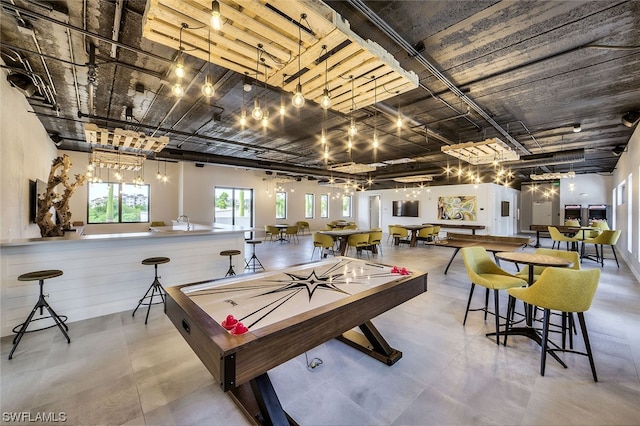 recreation room with concrete floors