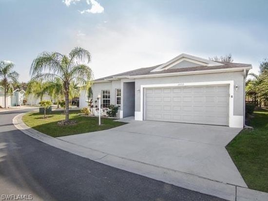 ranch-style home featuring a garage