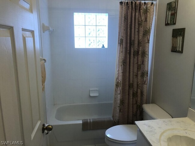 full bathroom featuring toilet, shower / tub combo with curtain, and large vanity