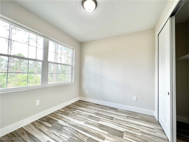 unfurnished bedroom with a closet