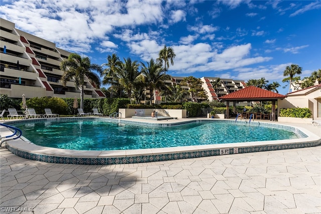 view of swimming pool featuring a gazebo and a patio area