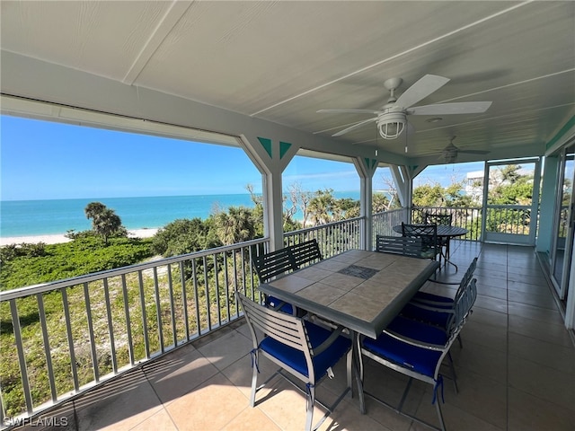 exterior space featuring a balcony, a water view, and ceiling fan