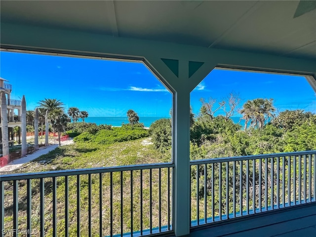 balcony featuring a water view