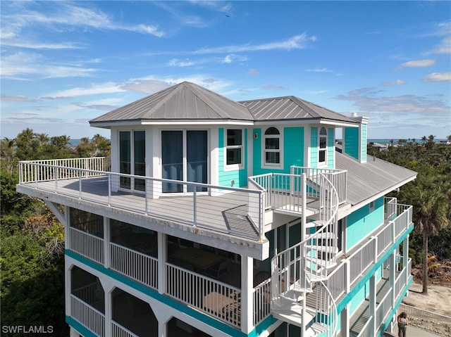 rear view of house featuring a balcony