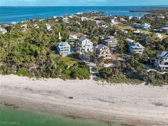 bird's eye view featuring a view of the beach and a water view