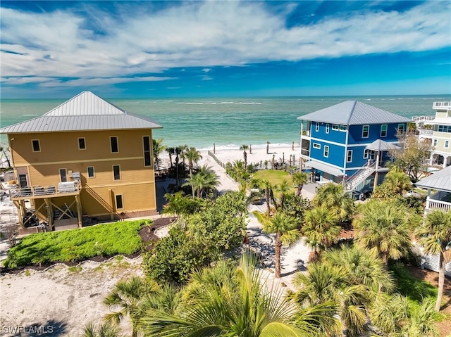 aerial view featuring a water view and a view of the beach