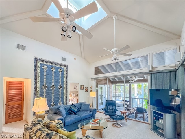 carpeted living room featuring a skylight, beam ceiling, high vaulted ceiling, and ceiling fan