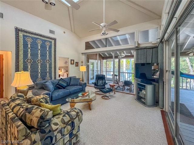 living room with carpet flooring, ceiling fan, and high vaulted ceiling