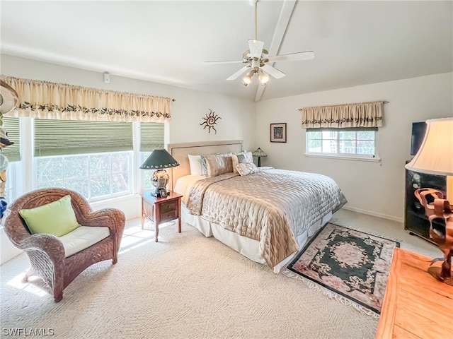 bedroom featuring light colored carpet, multiple windows, and ceiling fan