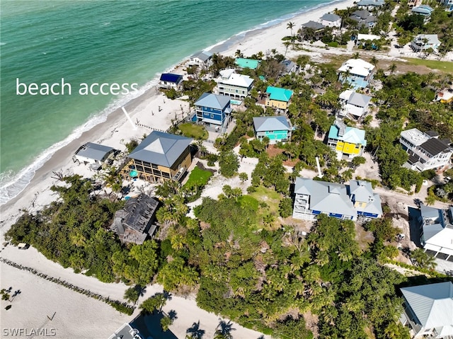 aerial view featuring a view of the beach and a water view