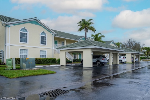 exterior space with a carport