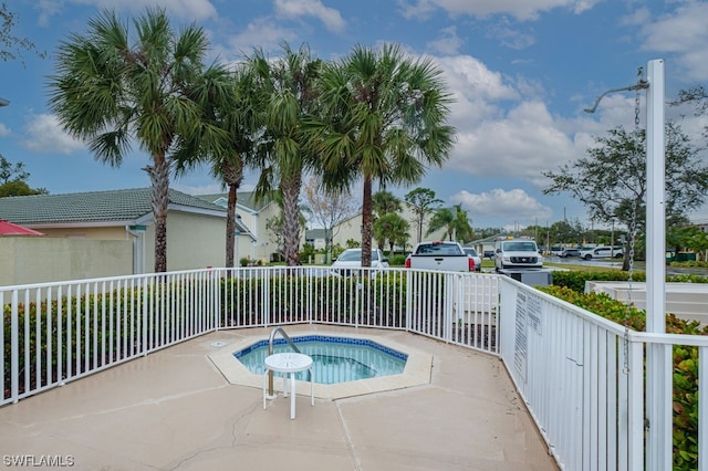 view of pool featuring an in ground hot tub