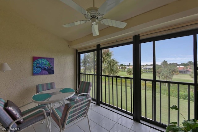 sunroom featuring ceiling fan