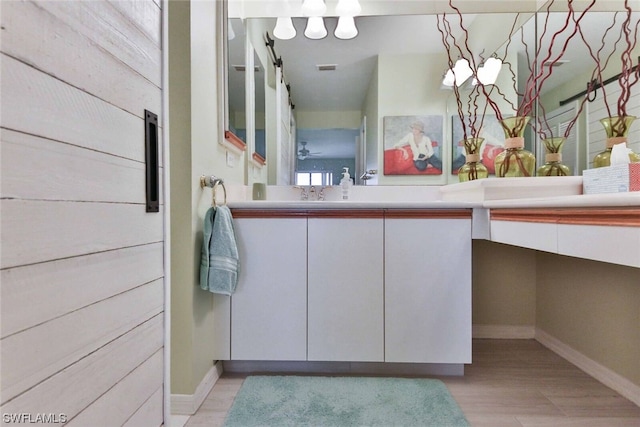 bathroom featuring vanity and hardwood / wood-style flooring