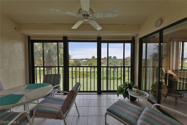 sunroom with plenty of natural light and ceiling fan