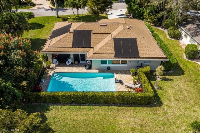 view of swimming pool with a patio area and a yard