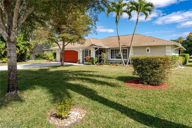 ranch-style home featuring a front yard and a garage