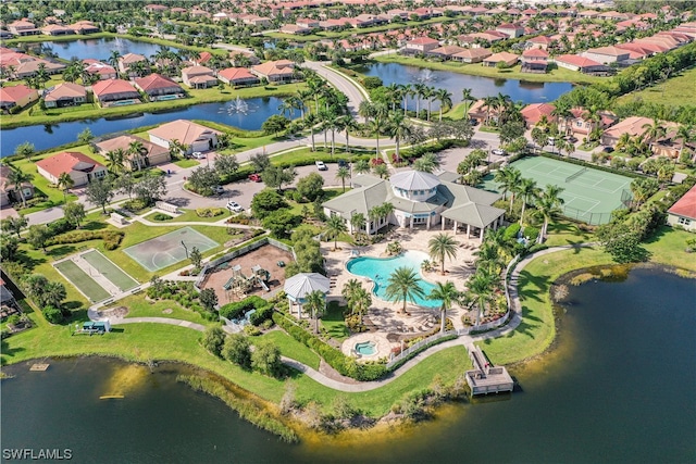 birds eye view of property with a water view