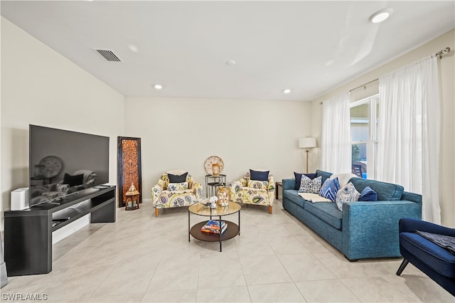 living room with light tile flooring