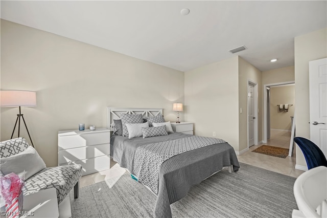 bedroom featuring light tile floors