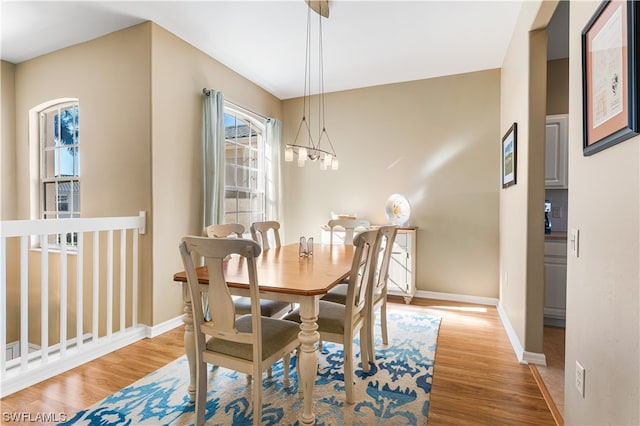 dining space with light hardwood / wood-style floors