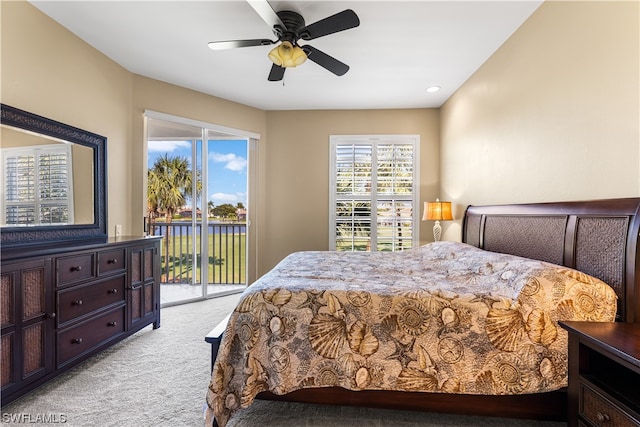 carpeted bedroom featuring ceiling fan and access to exterior