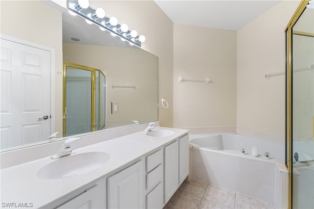 bathroom with vanity with extensive cabinet space, tile flooring, double sink, and plus walk in shower