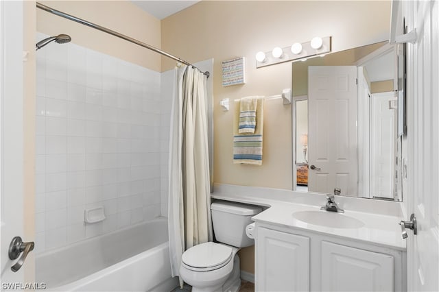 full bathroom featuring toilet, shower / tub combo with curtain, and vanity