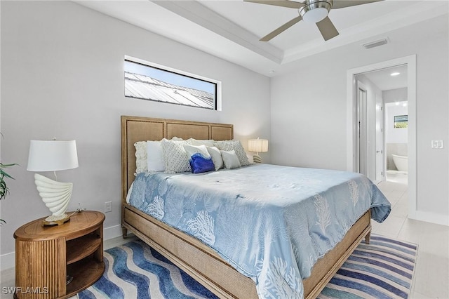 tiled bedroom featuring ensuite bath and ceiling fan