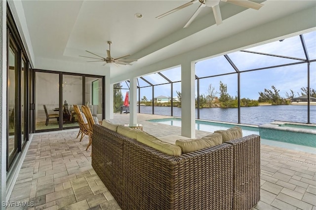 exterior space featuring a water view, ceiling fan, and a swimming pool