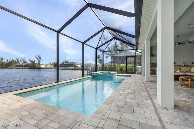 view of swimming pool with glass enclosure, an in ground hot tub, a water view, and a patio