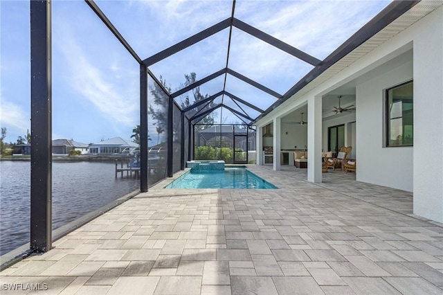 view of swimming pool with ceiling fan, a lanai, a patio area, an in ground hot tub, and a water view