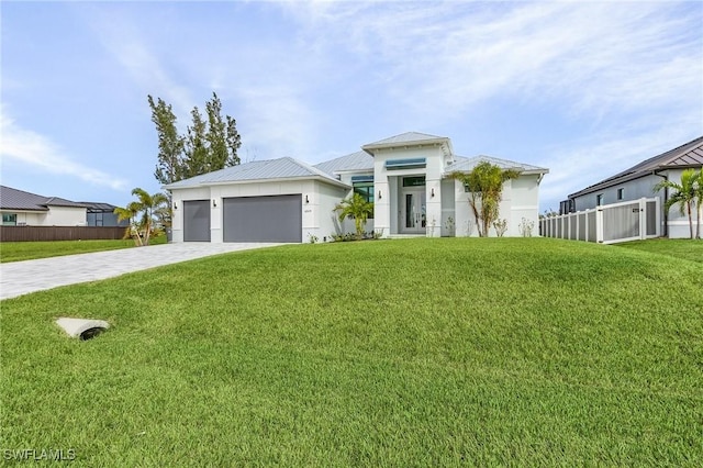 view of front facade with a front yard and a garage