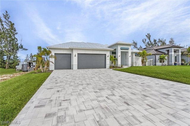 view of front facade with a garage and a front yard