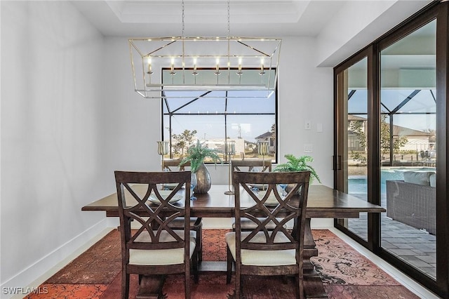 dining area with a chandelier and a healthy amount of sunlight