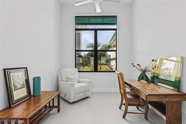 office area with ceiling fan, light hardwood / wood-style flooring, and a healthy amount of sunlight