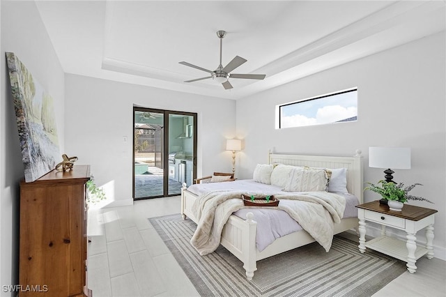 bedroom featuring access to exterior, multiple windows, and ceiling fan