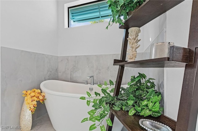 bathroom with a bathing tub and concrete floors