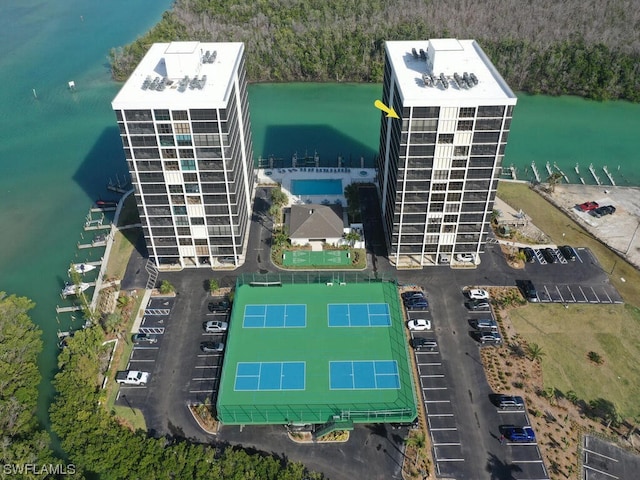 birds eye view of property with a water view