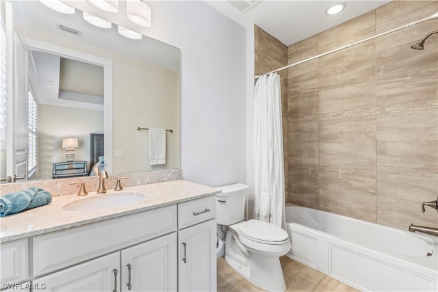 full bathroom with vanity, toilet, and shower / bath combo with shower curtain